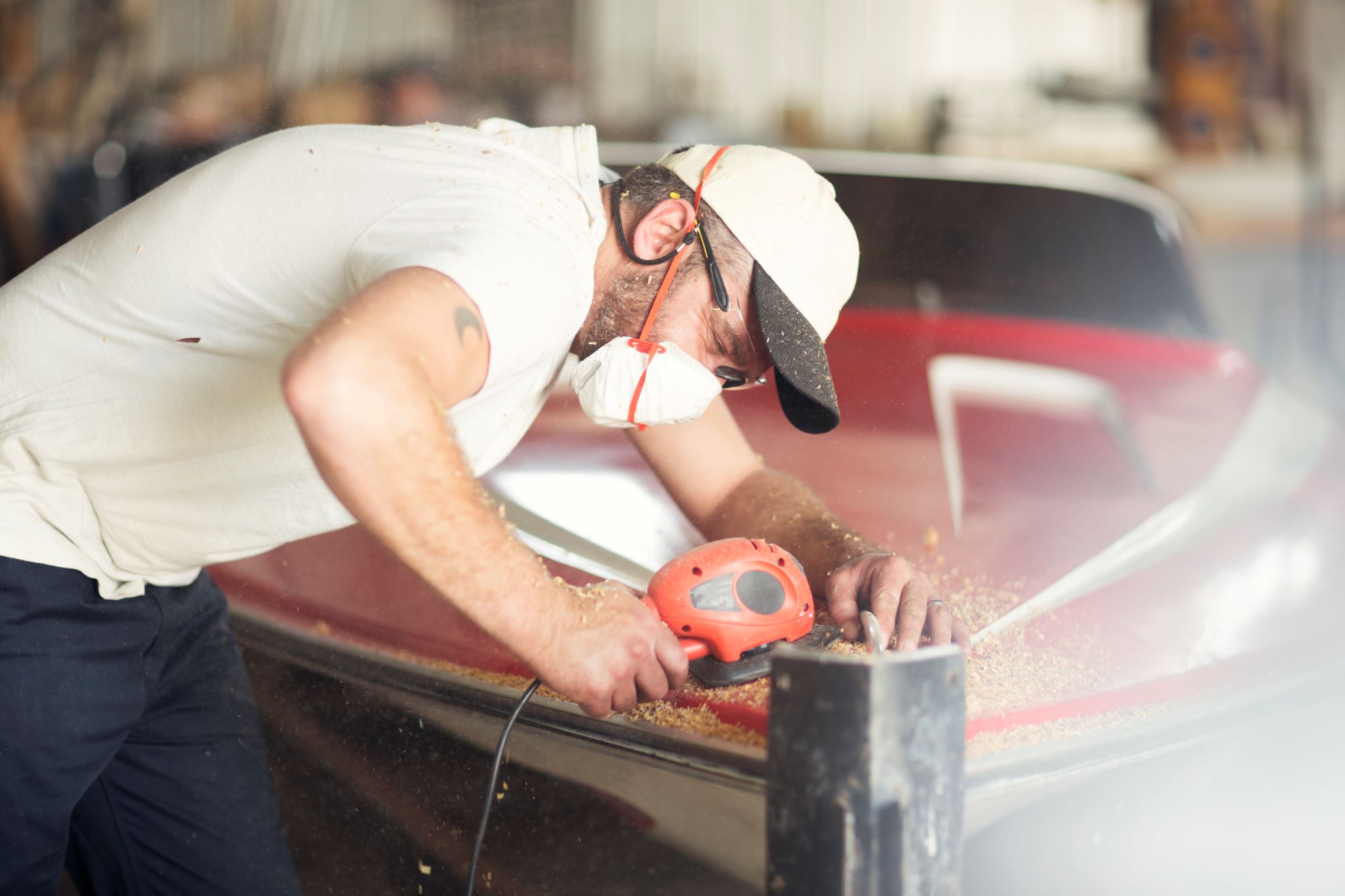 man fixing a boat